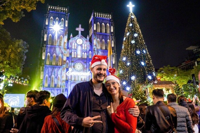 Tourists celebrate Christmas in Hanoi, Vietnam